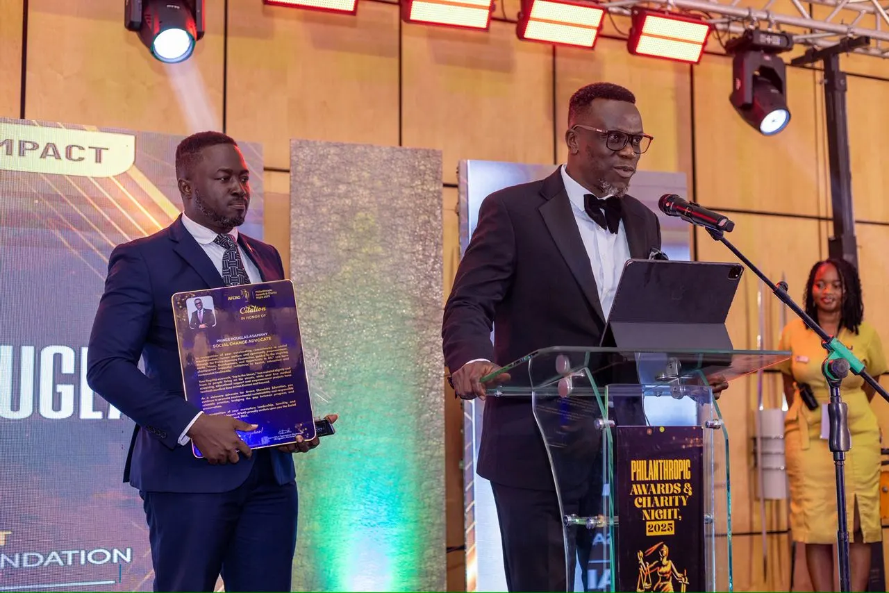 Award ceremony moment featuring Prince Douglas Asamany and AFLAG organisers