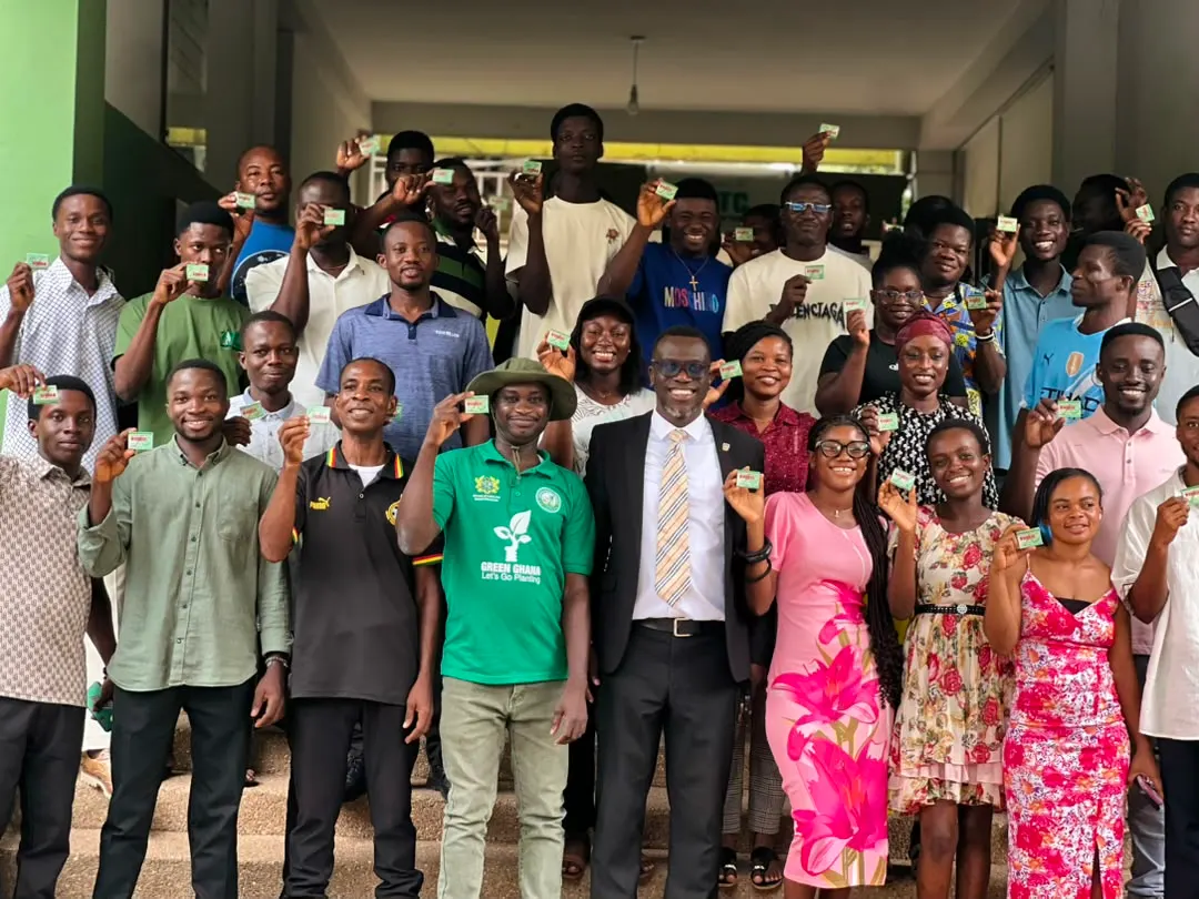 Students of the Certificate in Natural Resources Management programme hold up deworming tablets in a group photo on the steps of the Forestry Commission Training Centre