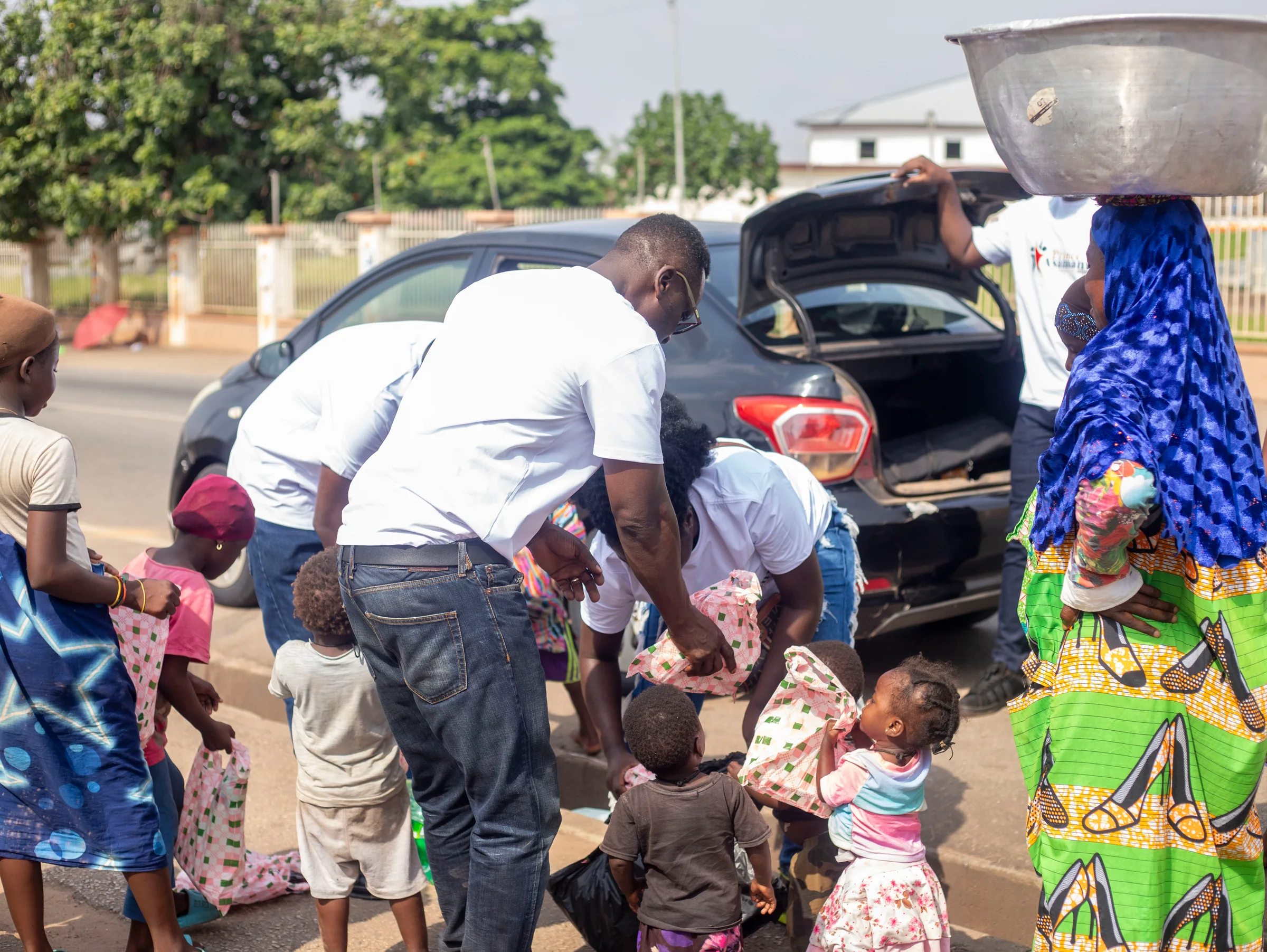 Foundation volunteers and residents gathered during community relief outreach