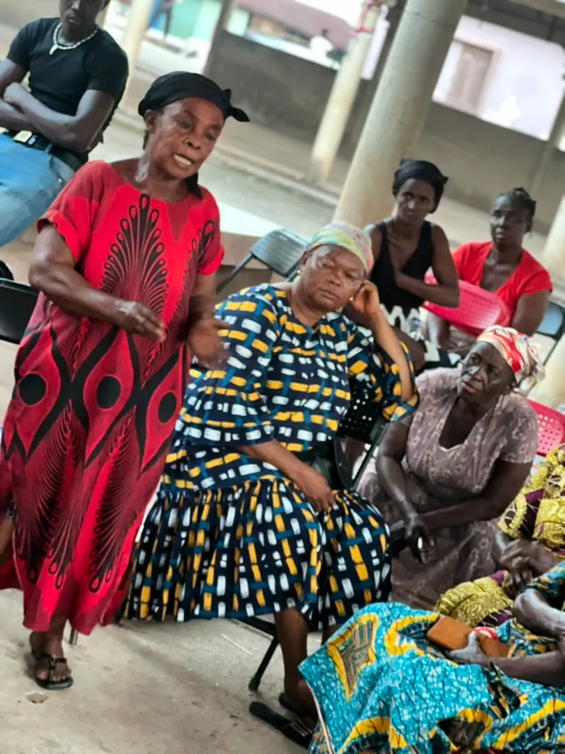 A speaker addresses seated community members during the engagement