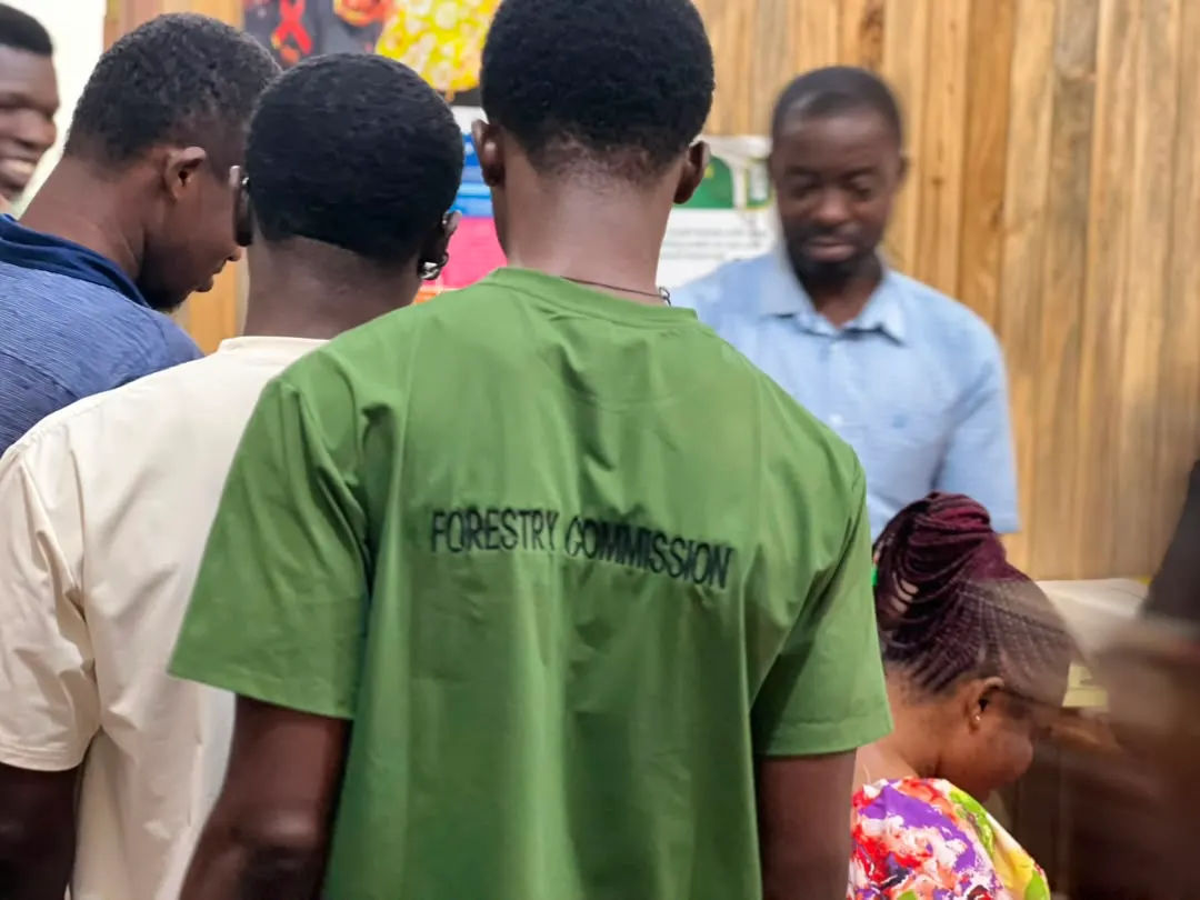 Students in Forestry Commission shirts gather inside the training centre during the deworming exercise